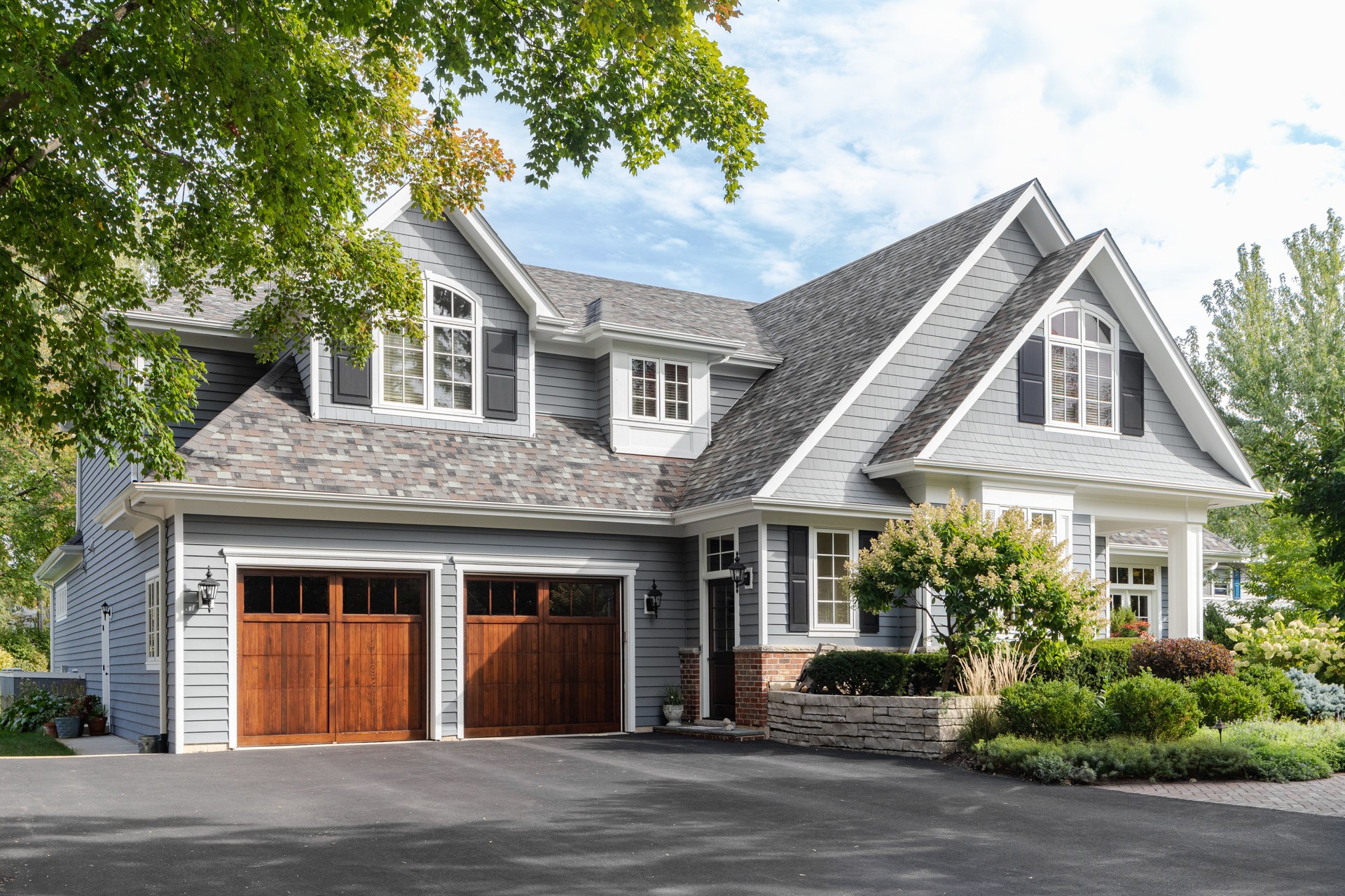 A grey and white modern farmhouse.